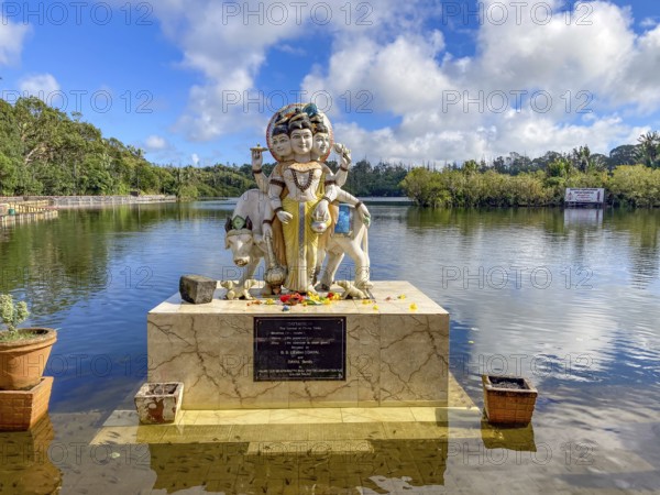 Three-headed sculpture Statue of Dattatreya embodiment of triform Trimurti combines characteristics of Brahma creation, Vishnu preservation and Shiva destruction of Hindu religion Hinduism, Eswarnath Shiv Jyotir Lingam Temple, crater lake Sacred Lake Ganga Talao, Le Pétrin, Grand Bassin, Mauritius