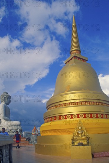 People, Buddha statue, chedi in Wat Tam Sua monastery, which is partly on the top of a mountain, Krabi, Thailand, December 2002, vintage, retro, old, historic