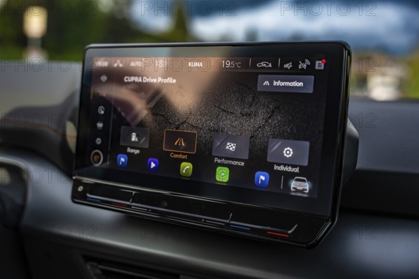 Modern infotainment display in a Cupra vehicle with various driving profiles and navigation options, Cupra electric car, e-car sharing, Calw, Germany