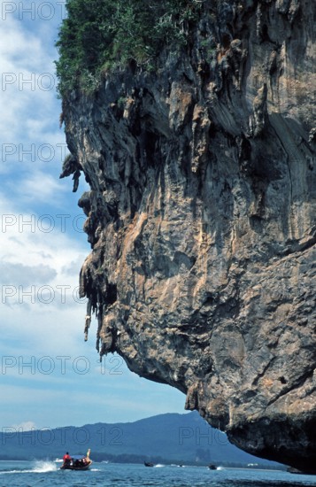 Longtail boat, rocks in the sea, Krabi, Thailand, December 2002, vintage, retro, old, historic
