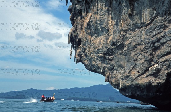 Longtail boat, rocks in the sea, Krabi, Thailand, December 2002, vintage, retro, old, historic