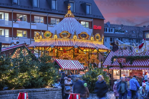 Nostalgic children's carousel at the children's Christmas market in the evening, Hans Sachs Platz, Nuremberg, Middle Franconia, Bavaria, Germany