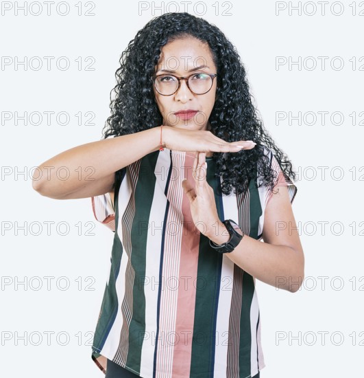 Afro girl gesturing time out isolated. Young afro woman gesturing time out with palms hands isolated