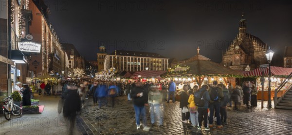 Christmas market illuminated in the evening with Frauekirche and town hall, Hauptmarkt, Nuremberg Middle Franconia, Bavaria, Germany