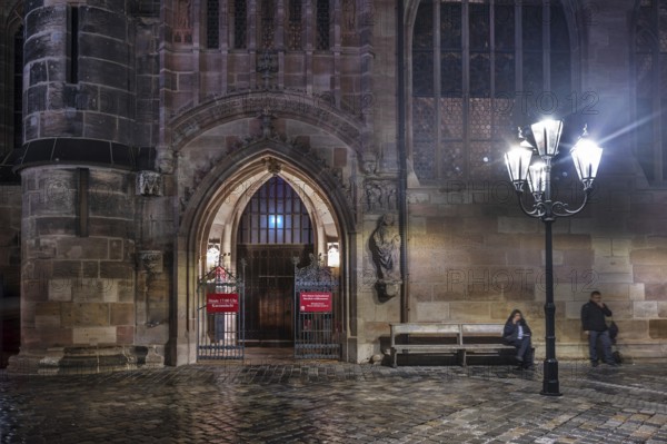 Illuminated entrance to Lorenz Church in the evening, Lorenzer Platz, Nuremberg, Middle Franconia, Bavaria, Germany