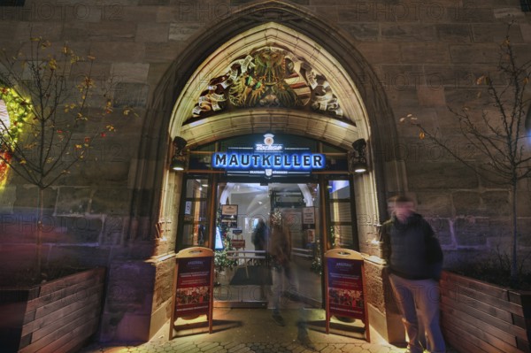 Historic entrance portal to the former Mauthalle, with imperial eagle and city coat of arms, built in 1498 and 1502, today the restaurant Zum Mautkeller, Königstr. Nürnberg, Middle Franconia, Bavaria, Germany
