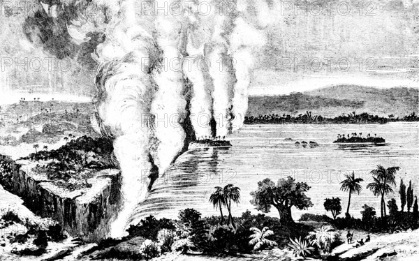 The Victoria Falls of the Zambezi in the border area between Zambia and Zimbabwe, UNESCO World Heritage Site, named after Queen Victoria, tropical vegetation, palm trees, water vapor, rising water columns, islands, riverbanks, natural wonders, attraction, tourist destination, historical illustration, 19th century