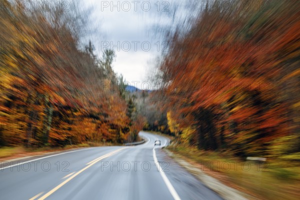 Car, rain-wet road, curvy country road, autumn leaves, Indian summer, smudge effect, blur, Kancamagus Highway, White Mountain, New Hampshire, New England, USA