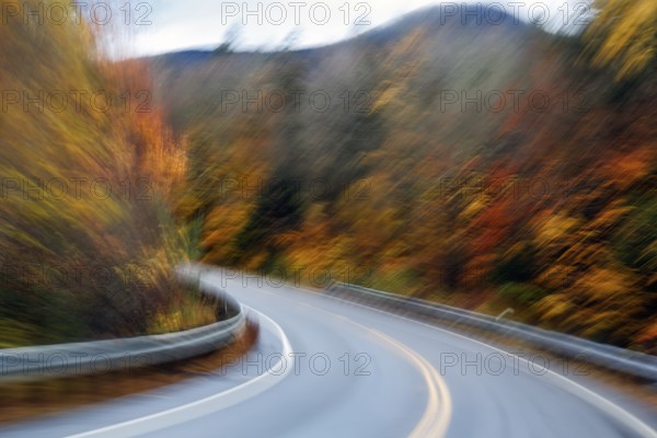 Curvy country road, autumn leaves, Indian summer, smudge effect, blur, Kancamagus Highway, White Mountain, New Hampshire, New England, USA