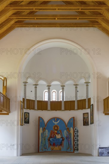 Church interior with icon wall under large white arches. Harmonious symmetry in space, German Evangelical Lutheran Church of the Redeemer, Schwabenstraße, village founded by Caucasian Germans, Assureti, Elizabeth Valley, Lower Kartli region, Georgia