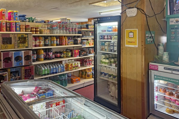 Small supermarket with fully stocked shelves and refrigerated products, shop on Westray Island, Orkney Islands, Scotland, Great Britain