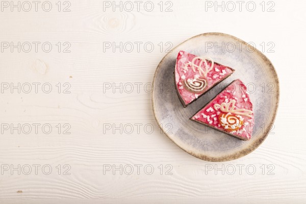 Chocolate cake on white wooden background, top view, flat lay, copy space