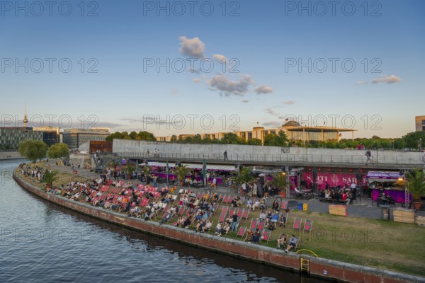 Summer evening at a beach bar in the government district on the Spree, Berlin