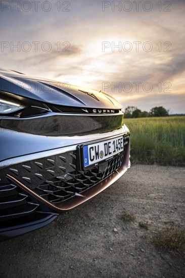 Close-up of the front of a car with sunset in the background, Deer e-car sharing, Cupra electric car, Germany