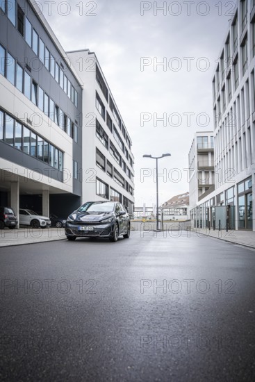 A car is parked on an empty street between modern buildings, Deer E-Car Sharing, Cupra electric car, Böblingen, Germany