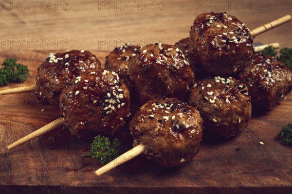 Tsukune, Japanese meatballs, minced chicken, fried on a skewer, with yakitori sauce, homemade, no people