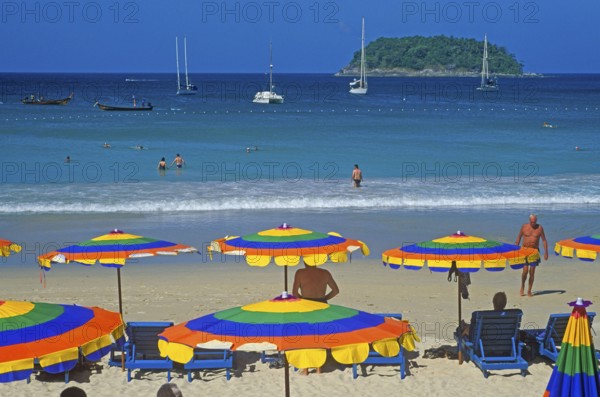 People, umbrellas, boats, island, Kata Beach, two years in front of the tsunami, Ko Phuket, Thailand, December 2002, vintage, retro, old, historic