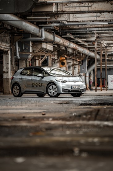 A vehicle is parked in an old factory with an industrial, raw character, Deer E-Car Sharing, Motorworld Rüsselsheim, Germany