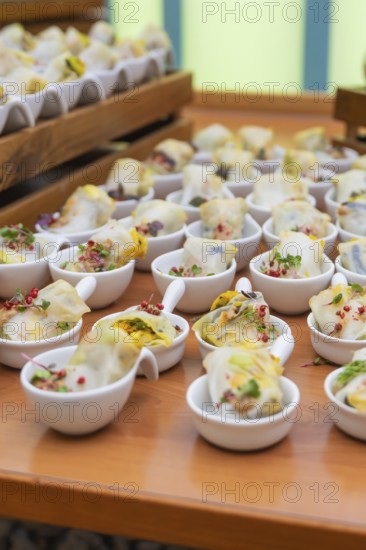 Various small bowls of dim sum arranged on a wooden table, Christmas party Dekra Congresshotel Wart, Calw district, Germany