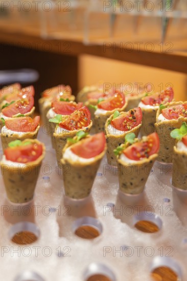 Small snacks with tomatoes and herbs presented on stylish pastries, Christmas party Dekra Congresshotel Wart, Calw district, Germany