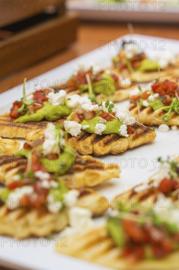 Fried gaufres with avocado and tomatoes on a white plate, Christmas party Dekra Congresshotel Wart, Calw district, Germany