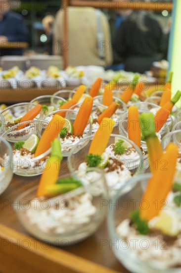 Glasses with decorative carrot garnish, elegantly placed for guests, Christmas party Dekra Congresshotel Wart, Calw district, Germany