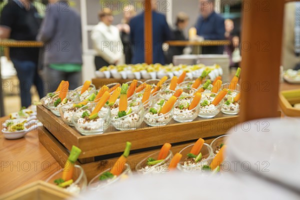 Freshly cut carrots displayed in attractive small glasses, Christmas party Dekra Congresshotel Wart, Calw district, Germany