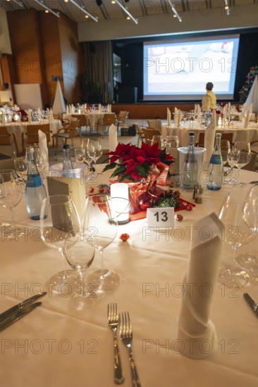 An elegantly set table with Christmas decoration and candle light, Christmas party Dekra Congresshotel Wart, Calw district, Germany