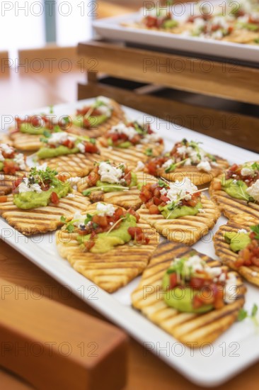 Creatively prepared tartines with guacamole and fresh garnish on wooden trays, Christmas party Dekra Congresshotel Wart, Calw district, Germany