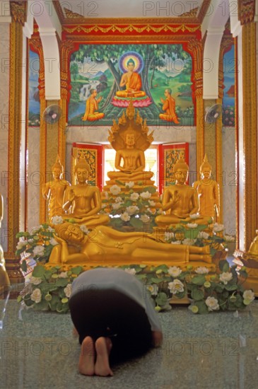 Believer praying, Wat Chalong monastery, Ko Phuket, Thailand, December 2002, vintage, retro, old, historic