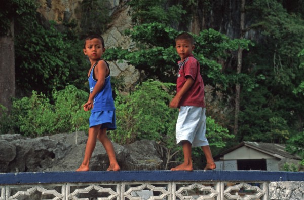 Little boys, children in the stilt village of Ko Pannyi in Phangnga Bay near Ko Phuket, two years in front of the tsunami, Thailand, December 2002, vintage, retro, old, historic
