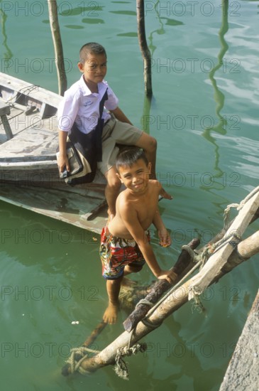 Little boys, children in the stilt village of Ko Pannyi in Phangnga Bay near Ko Phuket, two years in front of the tsunami, Thailand, December 2002, vintage, retro, old, historic
