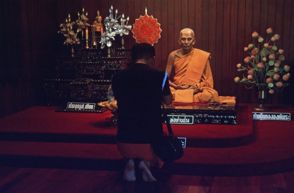 Wax monk at Wat Chalong monastery, believer praying, Ko Phuket, Thailand, December 2002, vintage, retro, old, historic