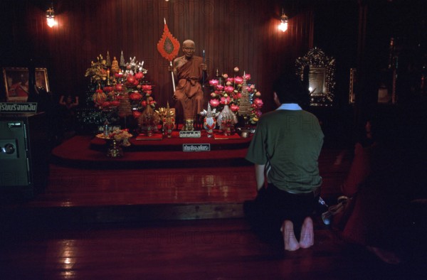 Wax monk at Wat Chalong monastery, believers praying, Ko Phuket, Thailand, December 2002, vintage, retro, old, historic