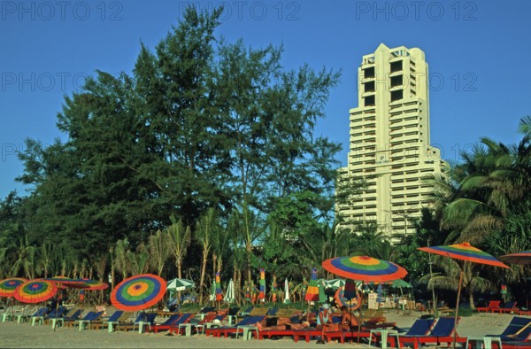 Skyscraper, umbrellas, people, Patong Beach, Ko Phuket, two years in front of the tsunami, Thailand, December 2002, vintage, retro, old, historic