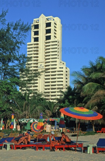 Skyscraper, umbrellas, people, Patong Beach, Ko Phuket, two years in front of the tsunami, Thailand, December 2002, vintage, retro, old, historic