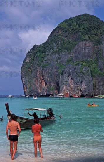 People, longtail boat on Maya Bay beach, known from the movie The Beach, one year in front of the tsunami, Ko Phi Phi Le, Thailand, December 2002, vintage, retro, old, historic