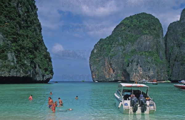People, boats on Maya Bay beach, known from the movie The Beach, one year in front of the tsunami, Ko Phi Phi Le, Thailand, December 2002, vintage, retro, old, historic