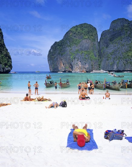 People and longtail boats on Maya Bay beach, known from the movie The Beach, one year in front of the tsunami, Ko Phi Phi Le, Thailand, December 2002, vintage, retro, old, historic