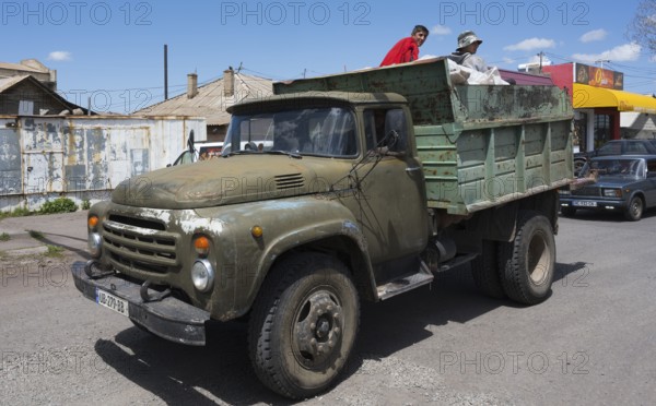 Old truck with men on a village road under blue sky, ZIL-130 truck, Samtskhe—Javakheti region, Samtske Javacheti, Lesser Caucasus, Georgia
