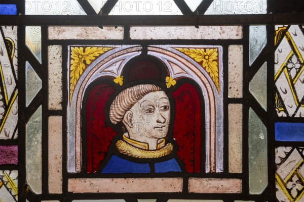 Close-up of medieval style male figure possibly a monk, Ufford church, Suffolk, England, UK