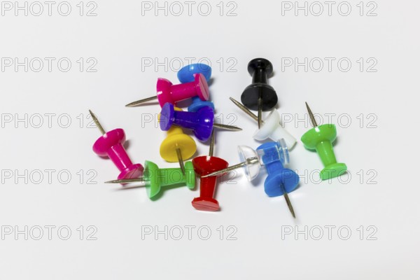 Different colored pencils lying on a white background, Germany