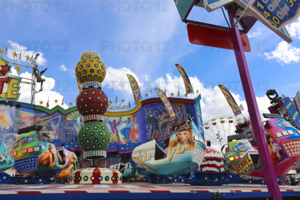 Fairground in Ulm Friedrichsau, folk festival, hustle and bustle, amusement park, amusement attraction, ride, blue sky, clouds, Ulm, Baden-Württemberg, Germany