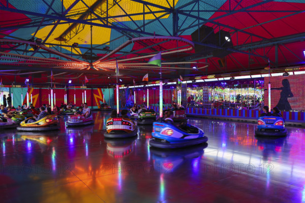 Bumper car, autodrome, bumper cars, boxing car, self-driver, fairground in Ulm Friedrichsau, public festival, hustle and bustle, ferris wheel, amusement park, amusement attraction, ride, clouds, Ulm, Baden-Württemberg, Germany