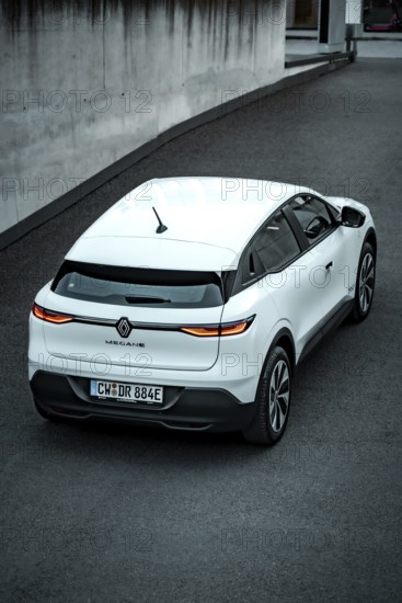 Rear view of a white modern SUV on a paved road, Deer e-car sharing, Renault Megane, Calw, Germany