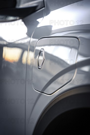 Close-up of a shiny car gas cap with logo and reflections, Deer E-Carsharing, Renault Megane, Calw, Germany