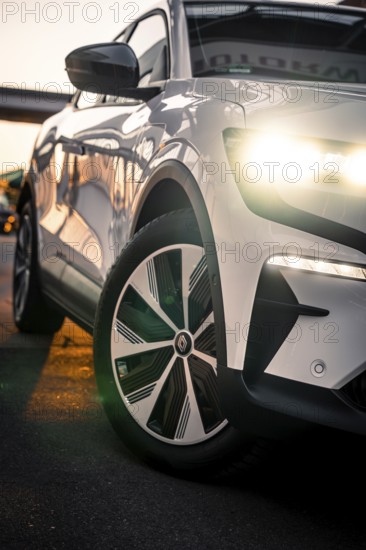 Front view of a car with shiny headlights in an urban environment, Deer E-Carsharing, Renault Megane, Calw, Germany