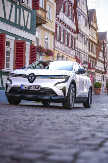 White car in a traditional old town with half-timbered houses and cobblestones, Deer e-Carsharing, Renault Megane, Calw, Germany