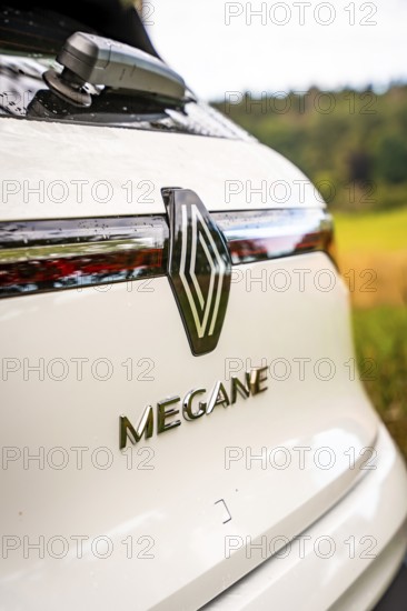 Rear of a white Renault Megane with logo against a natural backdrop, Deer e-Carsharing, Renault Megane, Calw, Germany