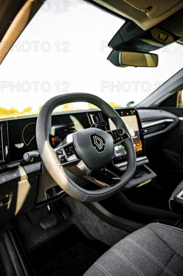 Interior view of a car with modern steering wheel and clear dashboard, Deer E-Carsharing, Renault Megane, Calw, Germany